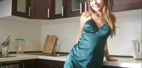  Beauty in a green skirt teases with curves